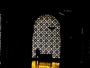 A man look out of the window of the Mezaquita, a beautiful mosque, turned into a Cathedral 