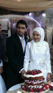 Asiful Islam and Zeynab Gamieldien cutting the cake. 